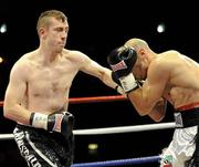 11 June 2010; Paul McCloskey lands a left to the body of Giuseppe Lauri during their European Light Welterweight Title fight. Yanjing Beer Fight Night, King's Hall, Belfast. Picture credit: Oliver McVeigh / SPORTSFILE