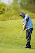 12 June 2010; Arun Ramalingam, Harolds Cross, Dublin, Eastern Region, chips onto the 18th green during the 18 hole Golf competition during the third day of the 2010 Special Olympics Ireland Games. Limerick Golf Club, Limerick. Picture credit: Stephen McCarthy / SPORTSFILE