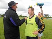 13 June 2010; Leitrim's Ciana Stringer pours water over Leitrim manager Pat McWeeney's head, as he is being interviewed after the game. All-Ireland U14 B Ladies Football Shield Final, Leitrim v Longford, Mullahoran, Co. Cavan. Photo by Sportsfile