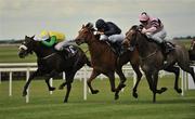 26 June 2010; Wild Wind, centre, with Johnny Murtagh up, on their way to winning the Tipperary Crystal European Breeders Fund Fillies Maiden from second place Laughing Lashes, right, with James McDonald up and third place Puttore, 10, with Declan McDonogh up. Irish Derby Festival, the Curragh Racecourse, Curragh, Co. Kildare. Picture credit: Barry Cregg / SPORTSFILE