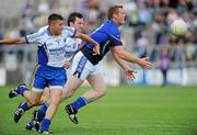 26 June 2010; Lorcan Mulvey, Cavan, in action against Darren Hayden and Brian McGrath, Wicklow. GAA Football All-Ireland Senior Championship Qualifier Round 1, Cavan v Wicklow, Kingspan Breffni Park, Cavan. Picture credit: Oliver McVeigh / SPORTSFILE