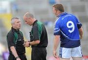 26 June 2010; Referee Cormac Reilly, right, consults with linesman Jimmy McKee before sending Cavan's Lorcan Mulvey, 9, off for a straight red card. GAA Football All-Ireland Senior Championship Qualifier Round 1, Cavan v Wicklow, Kingspan Breffni Park, Cavan. Picture credit: Oliver McVeigh / SPORTSFILE