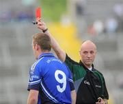 26 June 2010; Referee Cormac Reilly issues Lorcan Mulvey, Cavan, with a red card. GAA Football All-Ireland Senior Championship Qualifier Round 1, Cavan v Wicklow, Kingspan Breffni Park, Cavan. Picture credit: Oliver McVeigh / SPORTSFILE