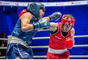 24 March 2016; Katie Taylor, right, Ireland, exchanges punches with Victoria Torres, Mexico, during their quarter-final bout. Astana, Kazakhstan. Photo by AIBA via Sportsfile