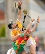 3 July 2010; Cormac Donnelly, Antrim, in action against Denis Murphy, Carlow. GAA Hurling All-Ireland Senior Championship Phase 1, Antrim v Carlow, Casement Park, Belfast, Co. Antrim. Photo by Sportsfile