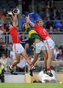 4 July 2010; Tomas Clancy, left, and John O'Rourke, Cork, contest a kick out with Damien Somers, Kerry. ESB Munster GAA Football Minor Championship Final, Kerry v Cork, Fitzgerald Stadium, Killarney, Co. Kerry. Picture credit: Brendan Moran / SPORTSFILE