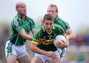 4 July 2010; Declan O'Sullivan, Kerry, in action against James Ryan, left, and Stephen Kelly, Limerick. Munster GAA Football Senior Championship Final, Kerry v Limerick, Fitzgerald Stadium, Killarney, Co. Kerry. Picture credit: Brendan Moran / SPORTSFILE