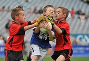 6 July 2010; Sean Mulleady, Tang/Maryland, Co. Westmeath, in action against Jake Kirwan, left, and Ryan Stronge, Na Fianna, Co. Offaly, during the ‘Play & Stay with the GAA’ Activity Days. Croke Park, Dublin. Picture credit: Barry Cregg / SPORTSFILE