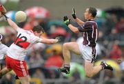 10 July 2010; Dessie Dolan, Westmeath, in action against Barry McGoldrick, Derry. GAA Football All-Ireland Senior Championship Qualifier, Round 2, Westmeath v Derry, Cusack Park, Mullingar, Co. Westmeath. Photo by Sportsfile