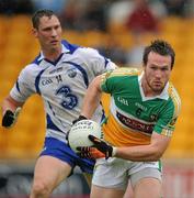 10 July 2010; Ross Brady, Offaly, in action against Gary Hurney, Waterford. GAA Football All-Ireland Senior Championship Qualifier, Round 2, Offaly v Waterford, O'Connor Park, Tullamore, Co. Offaly. Picture credit: David Maher / SPORTSFILE