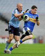 10 July 2010; Philip Austin, Tipperary, in action against Eoghan O'Gara, Dublin. GAA Football All-Ireland Senior Championship Qualifier, Round 2, Dublin v Tipperary, Croke Park, Dublin. Picture credit: Ray McManus / SPORTSFILE