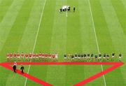 11 July 2010; President Mary McAleese, walks out to meets the Meath and Louth teams before the start of the game. Leinster GAA Football Senior Championship Final, Meath v Louth, Croke Park, Dublin. Picture credit: David Maher / SPORTSFILE