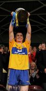11 July 2010; Paul Flanagan, Clare, lifts the cup after winning the Minor Munster Championship match over Waterford. ESB Munster GAA Hurling Minor Championship Final, Waterford v Clare, Semple Stadium, Thurles, Co. Tipperary. Picture credit: Barry Cregg / SPORTSFILE