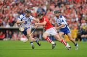 11 July 2010; Shane O' Neill, Cork, in action against Kevin Moran. left, and Eoin Mcgrath, Waterford. Munster GAA Hurling Senior Championship Final, Cork v Waterford, Semple Stadium, Thurles, Co. Tipperary. Picture credit: Barry Cregg / SPORTSFILE