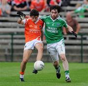 11 July 2010; Jamie Clarke, Armagh, in action against Barry Mulrone, Fermanagh. GAA Football All-Ireland Senior Championship Qualifier Round 2, Fermanagh v Armagh, Brewster Park, Enniskillen, Co. Fermanagh. Picture credit: Oliver McVeigh / SPORTSFILE