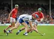 11 July 2010; Waterford team-mates John Mullane, left, and Shane Walsh compete for the silothar as Cork players Eoin Cadogan, left, and Brian Murphy watch on. Munster GAA Hurling Senior Championship Final, Cork v Waterford, Semple Stadium, Thurles, Co. Tipperary. Picture credit: Stephen McCarthy / SPORTSFILE