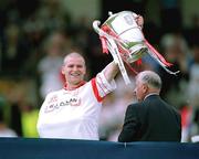 8 July 2001; Tyrone captain, Sean Teague, lifts the Anglo-Celt Cup. Tyrone v Cavan, Bank of Ireland Ulster Football Final, St. Tighearnach's Park, Clones, Co. Monaghan. Picture credit; David Maher / SPORTSFILE