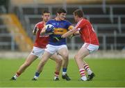 12 June 2016; Gavin Ryan of Tipperary in action against Michael Vaughan, left, and Brian Coughlan of Cork during their Munster GAA Football Junior Championship Semi-Final match between Tipperary and Cork at Semple Stadium in Thurles, Co Tipperary. Photo by Piaras Ó Mídheach/Sportsfile