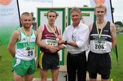 11 July 2010; Former World 5000m Champion Eamonn Coghlan congratulates Mark Christie, Mullingar Harriera AC, on winning the Men's 1500m, from bronze medallist Richard Corcoran, left, Raheny Shamrocks AC, and silver medallist Dan Mulhare, North Laois AC, during the Woodie's DIY AAI Senior Track & Field Championships. Morton Stadium, Santry, Dublin. Picture credit: Brendan Moran / SPORTSFILE