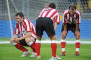 13 July 2010; Sunderland players Daryl Quinn, left, David Healy and Teemu Tainio, right, rest after a strenuous warm-down at half time. Friendly in Aid of Shane Geoghegan Trust, Munster XI v Sunderland AFC, Thomond Park, Limerick. Picture credit: Diarmuid Greene / SPORTSFILE