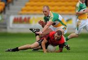 17 July 2010; Ambrose Rogers, Down, is fouled by Scott Brady, Offaly. GAA Football All-Ireland Senior Championship Qualifier Round 3, Down v Offaly, O'Connor Park, Tullamore, Co. Offaly. Picture credit: Barry Cregg / SPORTSFILE