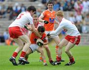 18 July 2010; Colin Stevenson, Armagh, in action against Conor Clarke, Niall Sluden and and Hugh Pat McGeary, Tyrone. ESB Ulster GAA Football Minor Championship Final, Tyrone v Armagh, St Tighearnach's Park, Clones, Co. Monaghan. Picture credit: Oliver McVeigh / SPORTSFILE