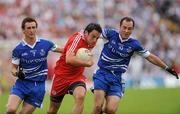 18 July 2010; Davy Harte, Tyrone, in action against Gary McQuaid and Stephen Gollogly, Monaghan. Ulster GAA Football Senior Championship Final, Monaghan v Tyrone, St Tighearnach's Park, Clones, Co. Monaghan. Picture credit: Oliver McVeigh / SPORTSFILE