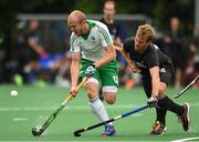 14 June 2016; Eugene Magee of Ireland is tackled by Gordon Johnston of Canada during the Men's Hockey International match between Ireland and Canada at the Trinity Sports Grounds in Dublin. Photo by Ramsey Cardy/Sportsfile