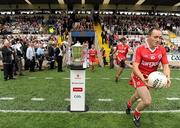 18 July 2010; Tyrone captain Brian Dooher runs out past the Anglo Celt cup before the game. Ulster GAA Football Senior Championship Final, Monaghan v Tyrone, St Tighearnach's Park, Clones, Co. Monaghan. Picture credit: Brendan Moran / SPORTSFILE