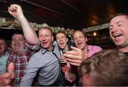 19 June 2016; Rally fans celebrate at The Glen bar after Manus Kelly and Donall Barrett win the 2016 Joule Donegal International Rally  in a Subaru Impreza WRC S12B, Glen Co.Donegal. Photo by Philip Fitzpatrick/Sportsfile