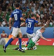 22 June 2016; James McClean of Republic of Ireland is tackled by Federico Bernardeschi of Italy during the UEFA Euro 2016 Group E match between Italy and Republic of Ireland at Stade Pierre-Mauroy in Lille, France. Photo by David Maher / Sportsfile