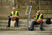 1 August 2010; Two GAA officals take a break before the hard work starts ahead of the Roscommon v Cork game. GAA Football All-Ireland Senior Championship Quarter-Final, Roscommon v Cork, Croke Park, Dublin. Picture credit: Barry Cregg / SPORTSFILE