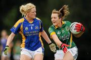 2 August 2010; Mary Sheridan, Meath, in action against Kelly Hackett, Tipperary. TG4 Ladies Football All-Ireland Senior Championship Qualifier, Tipperary v Meath, St Rynagh's, Banagher, Co. Offaly. Photo by Sportsfile