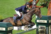 4 August 2010; Denis Lynch, Ireland, on Abberuail Van Het Dingeshof, during The Irish Sports Council Classic. Failte Ireland Dublin Horse Show, RDS, Ballsbridge, Dublin. Picture credit: Matt Browne / SPORTSFILE