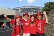 4 August 2010; Manchester United fans, from left, Micheal Farrell, aged 10, from Clonee, Co. Meath, Dylan Hand, aged 9, from Clonee, Co. Meath, Thomas Sherwin, aged 11, from Dublin and James Sherwin, aged 13, from Dublin, on their way to the game. Friendly Match, Airtricity League XI v Manchester United, Aviva Stadium, Lansdowne Road, Dublin. Photo by Sportsfile