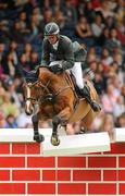 7 August 2010; Trevor Breen, competing on Checker 5, Ireland, fails to clear the 'Wall' during the Land Rover Puissance. Failte Ireland Dublin Horse Show, RDS, Ballsbridge, Dublin. Picture credit: Stephen McCarthy / SPORTSFILE