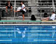 8 August 2010; Ireland swimmers Clare Dawson, 50m, 100m, & 200m Freestyle, from Bangor, Co. Down, right, and Grainne Murphy, 400m, 800m & 1500m Freestyle, 200m Butterfly, from New Ross, Co. Wexford, stretch in the company of Head Coach Ronald Claes, during training ahead of the 2010 LEN European Long Course Swimming Championships. Alfred Hajos Swimming Complex, Budapest, Hungary. Picture credit: Brian Lawless / SPORTSFILE