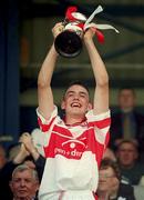 15 July 2001; Derry captain Dominic McGuigan lifts the cup after the Ulster Minor Hurling Championship Final match between Derry and Antrim at Casement Park in Belfast. Photo by Aoife Rice/Sportsfile