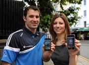 10 August 2010; Dublin footballer Bryan Cullen and Vodafone’s Interim Head of Corporate Affairs Christine Heffernan at the launch of Vodafone’s new Hill16 iPhone application designed to provide Dublin fans on the move with all the latest GAA information for their club and county. Molly Malone Statue, Grafton Street, Dublin. Picture credit: Ray McManus / SPORTSFILE