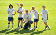 11 August 2010; Tipperary hurling star forward Lar Corbett with young players from Na Fianna GAA Club, Dublin, from left, Rebecca Cullen, age 10, from Glasnevin, Kevin Burke, age 10, from Phibsborough, Lucy Skelly, age 8, and Paddy Skelly, age 10, both from Drumcondra, at the launch of Gaelstar, Lidl's top quality own brand hurling range which includes hurleys, sliotars and grips. Na Fianna GAA Club, Glasnevin, Co. Dublin. Picture credit: Brendan Moran / SPORTSFILE