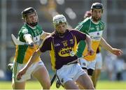 2 July 2016; David Dunne of Wexford is tackled by Sean Gardiner and James Mulrooney, 10, of Offaly during GAA Hurling All-Ireland Senior Championship Round 1 match between Wexford and Offaly at Innovate Wexford Park in Wexford. Photo by Matt Browne/Sportsfile