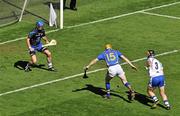 15 August 2010; Lar Corbett, Tipperary, beats  Waterford full-back Liam Lawlor, 3, and goalkeeper Clinton Hennessy to score his side's first goal. GAA Hurling All-Ireland Senior Championship Semi-Final, Waterford v Tipperary, Croke Park, Dublin. Picture credit: Brendan Moran / SPORTSFILE