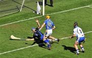 15 August 2010; Lar Corbett, Tipperary, beats Waterford full-back Liam Lawlor and goalkeeper Clinton Hennessy to score his side's first goal. GAA Hurling All-Ireland Senior Championship Semi-Final, Waterford v Tipperary, Croke Park, Dublin. Picture credit: Brendan Moran / SPORTSFILE