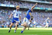 15 August 2010; Eoin Kelly, Tipperary, celebrates after scoring his side's third goal as Eoin Murphy, Waterford, watches on. GAA Hurling All-Ireland Senior Championship Semi-Final, Waterford v Tipperary, Croke Park, Dublin. Picture credit: Stephen McCarthy / SPORTSFILE