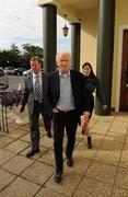 17 August 2010; Republic of Ireland manager Giovanni Trapattoni arrives with Republic of Ireland Team Security Officer Tony Hickey and translator Manuela Spinelli before his first press conference after his discharge from the Mater Hospital. Grand Hotel, Malahide, Dublin. Picture credit: Ray McManus / SPORTSFILE