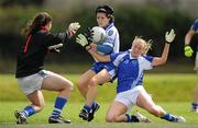 21 August 2010; Therese McNally, Monaghan, in action against Angela Casey, right, and goalkeeper Caoimhe Dollard, Laois. TG4 Ladies Football All-Ireland Senior Championship Quarter-Final, Monaghan v Laois, St Rynagh's, Banagher, Co. Offaly. Picture credit: Brendan Moran / SPORTSFILE