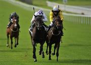 21 August 2010; Banimpire, left, with Kevin Manning up, pasts the post ahead of Ballybacka Lady, with Danny Mullins up, to win The Loder European Breeders Fund Fillies Race. Horse Racing, Curragh Racecourse, Co. Kildare. Picture credit: Barry Cregg / SPORTSFILE