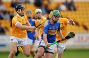 21 August 2010; John O'Dwyer, Tipperary, in action against Stephen Shannon, 4, and Kevin Molloy, Antrim. Bord Gais Energy GAA Hurling Under 21 All-Ireland Championship Semi-Final, Tipperary v Antrim, O'Connor Park, Tullamore, Co. Offaly. Picture credit: Ray McManus / SPORTSFILE