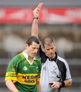 21 August 2010; Referee Damien Brazil issues a read card to Brendan Guiney, Kerry, in the second half. GAA Football All-Ireland Junior Championship Final, Kerry v Sligo, Pearse Stadium, Galway. Picture credit: Oliver McVeigh / SPORTSFILE