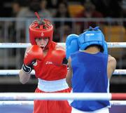 22 August 2010; Ryan Burnett, Ireland, in action against Zohidjon Hoorboyev, Uzbekistan, during their Men's Light Fly 48Kg Semi-Final. Burnett won the bout 2-1 to advance to the final. 2010 Youth Olympic Games, Bisham Stadium, Singapore. Picture credit: James Veale / SPORTSFILE